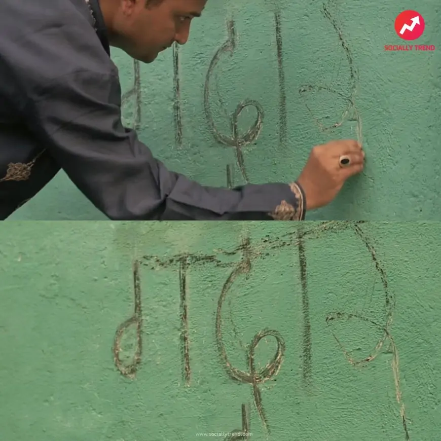 Man writing gaddar in entrance of Kabir Khan’s home